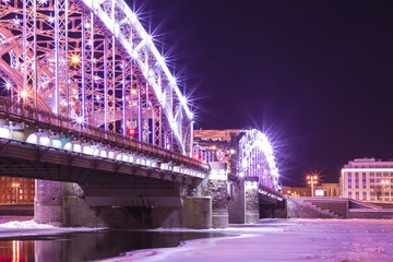 Obraz premium View on the Bolsheokhtinsky or Peter the Great Bridge across the Neva River in Saint Petersburg, Russia in the winter night