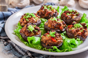 Baked champignon caps stuffed with minced meat