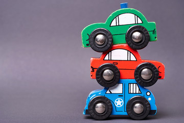 Close Up of used colorful toy cars - car pyramid