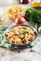 Creamy farfalle pasta with salmon, parmesan cheese and dill