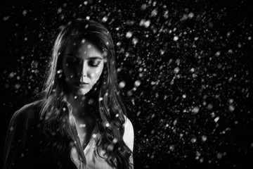 sad woman under snow
