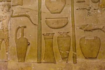 Egyptian ancient hieroglyphs on the stone wall