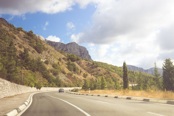 Asphalt road on a sunny summer day. Crimean mountains