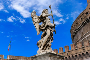 Fototapeta na wymiar Statue of an angel on the background Castle Sant'Angelo, Rome, Italy