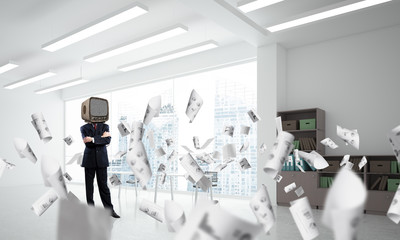 Businessman with an old TV instead of head.