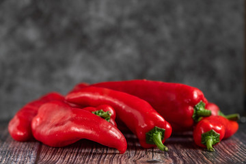 Red Peppers on a wooden background. Healthy food. Fresh vegetables