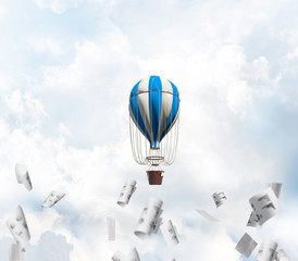 Fototapeta na wymiar Flying hot air balloon in the air.