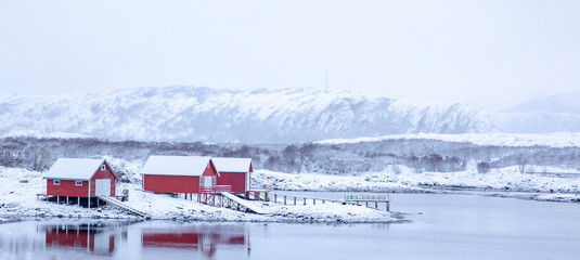 Red seahouse A winter day with snow in Brønnøy municipality, Nordland county