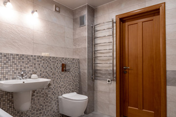 interior of modern bathroom with bath, shower and toilet