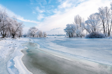 Landscape with frozen water, ice and snow on the Dnieper river in Kiev, Ukraine, during winter