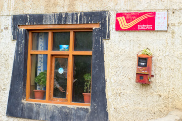Window and mailbox of the post office in India