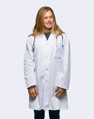 Fototapeta premium Doctor man is a little bit nervous and scared pressing the teeth on isolated background