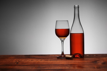 bottle of wine with poured goblet