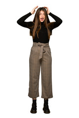 Full-length shot of Pretty girl with surprise and shocked facial expression on isolated white background