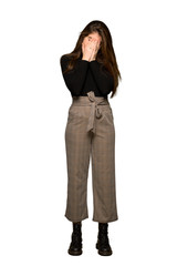 Full-length shot of Pretty girl with tired and sick expression on isolated white background