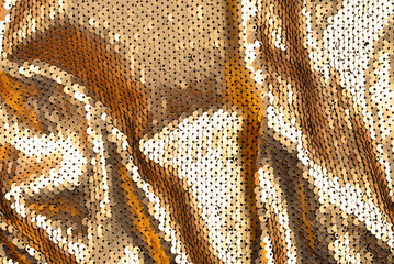 Golden sequins fabric texture.