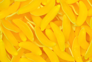 Yellow banana gummy candies. Top view. Jelly  sweets.