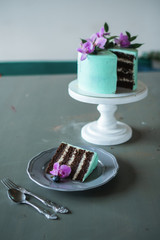 Wedding, festive, birthday biscuit cake decorated with pink orchid and blueberry