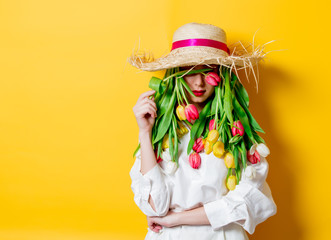 woman with fresh springtime tulips instead hair