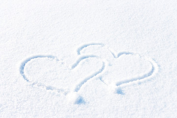 The shape of heart on the snow. Closeup shot.