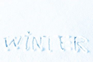 Text Hello winter and little blue pail of snow. Pastel color, snowy greeting card. Winter holidays concept.
