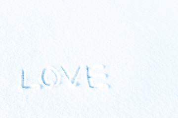 Love in the winter on the snow, the inscription on the snow.