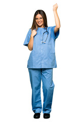 Full body of Young nurse celebrating a victory