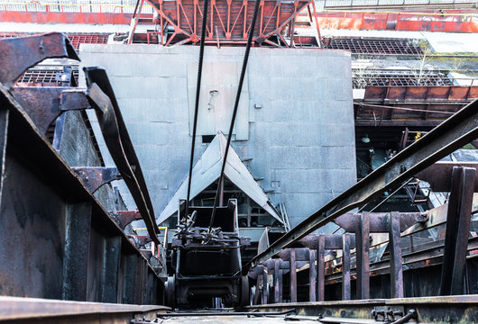 Vertical hoist cart for transporting ore at an old mining plant. View from above
