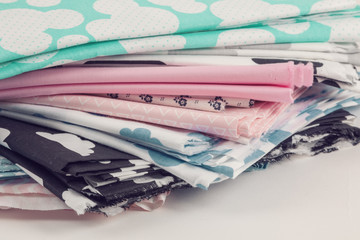 Stack of 100% cotton fabric material for tailor or homework, sewing concept