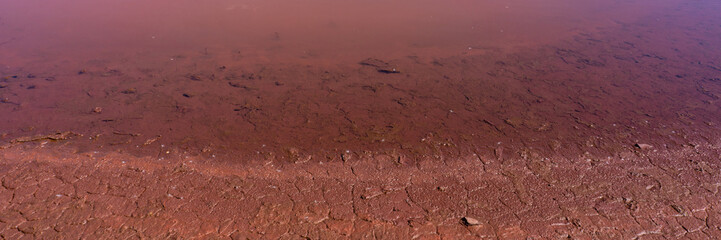 contaminated water and soil with iron oxides in the industrial zone.  Banner for design.