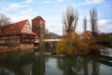 Fototapeta na wymiar Nuremberg, Hangman's House, Hangman's Bridge over the Pegnitz River and Water tower in winter day , Germany