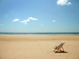 Fototapeta na wymiar Lone beach chair