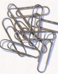 The paper clip is used to fasten paper sheets.