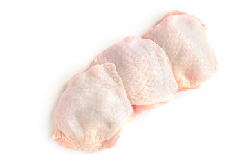 Raw chicken thighs isolated on white background.