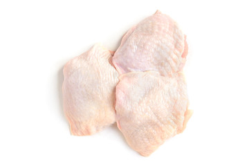 Raw chicken thighs isolated on white background.
