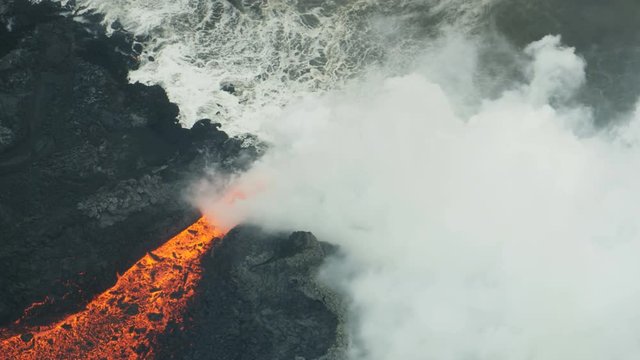 Aerial view hot lava ocean steam rising Hawaii