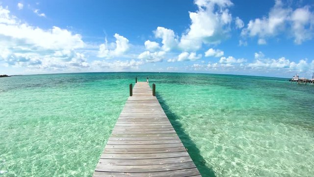 Jetty on Caribbean beach in luxury destination Bahamas