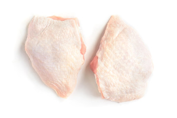 Raw chicken thighs isolated on white background.