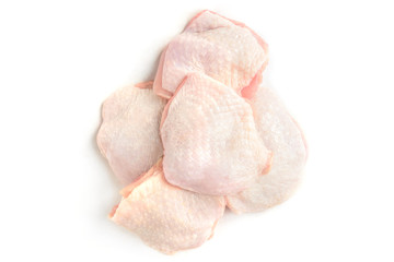Raw chicken thighs isolated on white background.