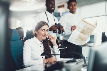 Group of young air dispatchers working together