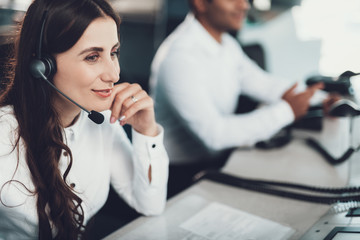 Smiling female operator working on dispatch board