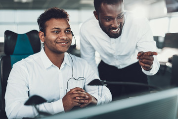 Two cheerful operators working on dispatch board