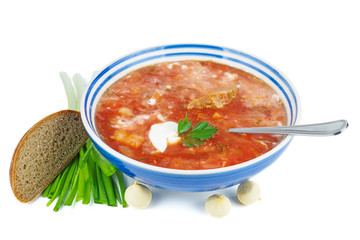 Porcelain bowl with traditional Ukrainian borscht (beet root soup) isolated on white background.