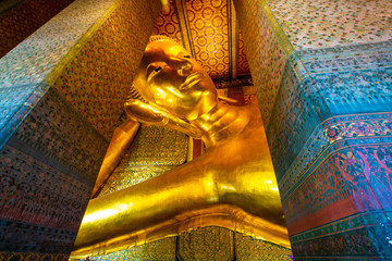 Gold statue reclining buddha indoor of Wat Pho buddhist temple