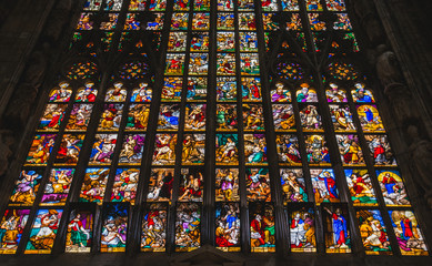 MILAN, ITALY - AUGUST 18 2018: Giant colorful window of Milano Duomo Cathedral with apostolic depictions