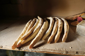 Homemade fresh brad on a shelf in bakery.