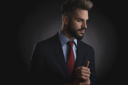 portrait of attractive smart casual man looking to side
