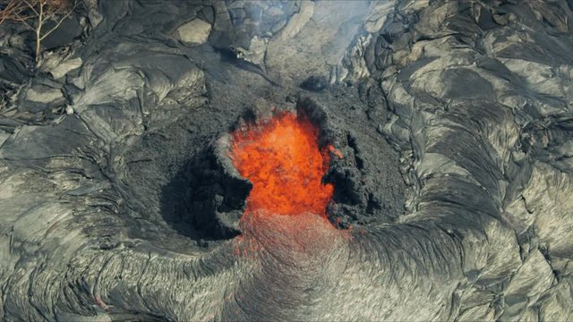 Aerial view of active volcanic activity destroying trees