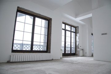 Repair work in the room with large windows.