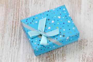 Gift box on wooden table